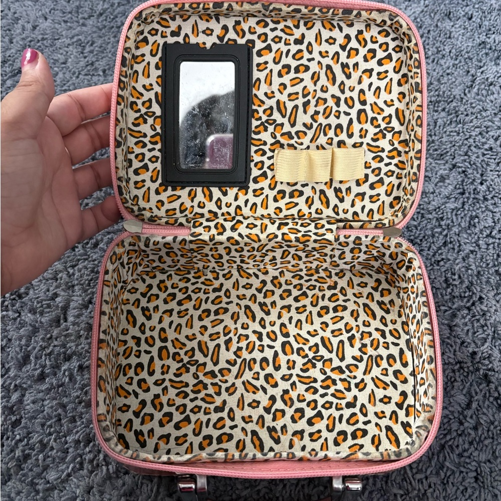 Lightly used peach jewelry or makeup holder